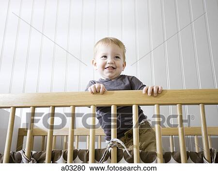 USA, Utah, Provo, Baby boy (18-23 months) standing in crib View Large Photo Image Stock Image - USA, Utah, Provo, Baby boy (18-23 months) standing in crib. Fotosearch