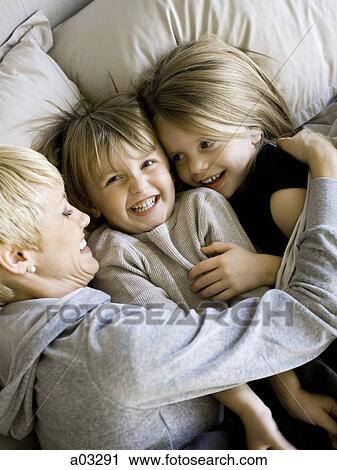 USA, Utah, Provo, Boy and girl (2-5) in bed with mother View Large Photo Image Stock Image - USA, Utah, Provo, Boy and girl (2-5) in bed with mother. Fotosearch