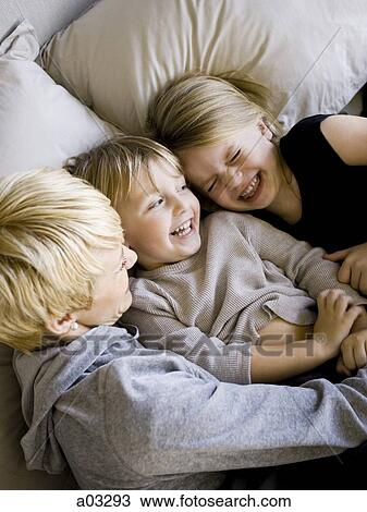 USA, Utah, Provo, Boy and girl (2-5) in bed with mother View Large Photo Image Stock Image - USA, Utah, Provo, Boy and girl (2-5) in bed with mother. Fotosearch