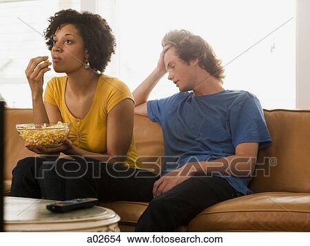 USA, Utah, Provo, couple sitting on sofa View Large Photo Image Picture - USA, Utah, Provo, couple sitting on sofa. Fotosearch