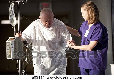 Picture - USA, Utah, Provo, female nurse helping senior man in hospital. Fotosearch