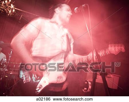 USA, Utah, Provo, man playing electric guitar View Large Photo Image Stock Photograph - USA, Utah, Provo, man playing electric guitar. Fotosearch