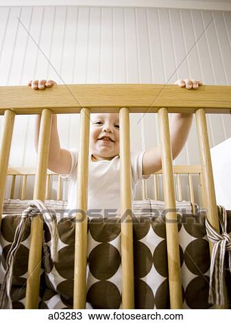 USA, Utah, Provo, Portrait of baby boy (18-23 months) in crib View Large Photo Image Stock Image - USA, Utah, Provo, Portrait of baby boy (18-23 months) in crib. Fotosearch