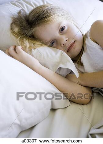 USA, Utah, Provo, Portrait of girl (4-5) lying in bed View Large Photo Image Stock Photo - USA, Utah, Provo, Portrait of girl (4-5) lying in bed. Fotosearch