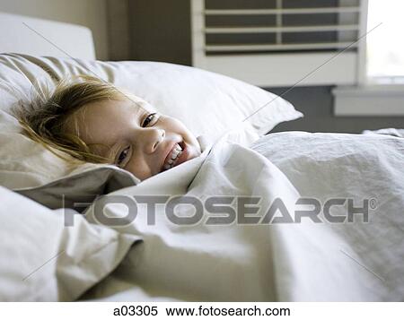 USA, Utah, Provo, Portrait of girl (4-5) lying in bed View Large Photo Image Stock Photography - USA, Utah, Provo, Portrait of girl (4-5) lying in bed. Fotosearch
