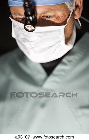 USA, Utah, Provo, portrait of surgeon during operation View Large Photo Image Stock Photo - USA, Utah, Provo, portrait of surgeon during operation. Fotosearch