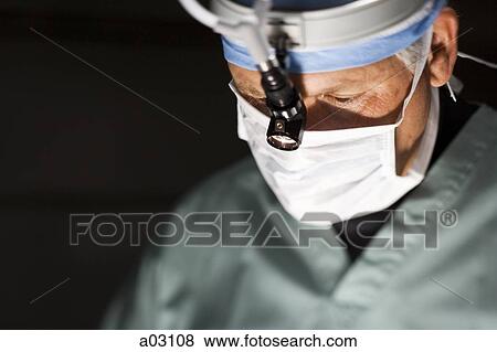 USA, Utah, Provo, portrait of surgeon during operation View Large Photo Image Stock Photo - USA, Utah, Provo, portrait of surgeon during operation. Fotosearch