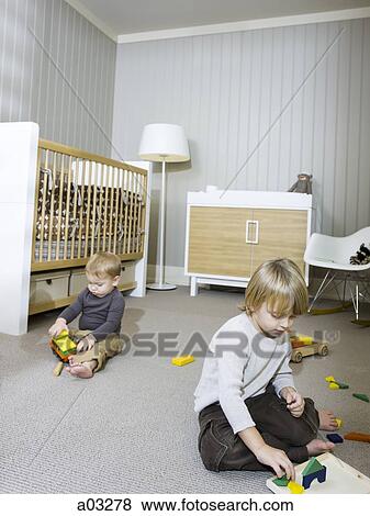 USA, Utah, Provo, Two boys (18-23 months, 2-3) playing in home View Large Photo Image Stock Photo - USA, Utah, Provo, Two boys (18-23 months, 2-3) playing in home. Fotosearch