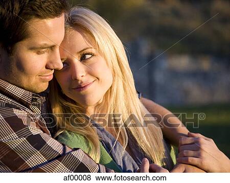 Stock Photo - USA, Utah, Provo, Young couple embracing. Fotosearch