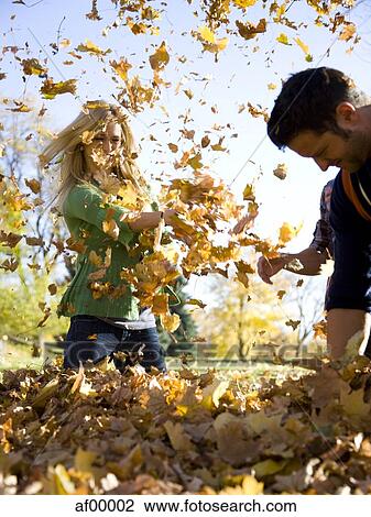 USA, Utah, Provo, Young couple having fun in park View Large Photo Image Stock Image - USA, Utah, Provo, Young couple having fun in park. Fotosearch