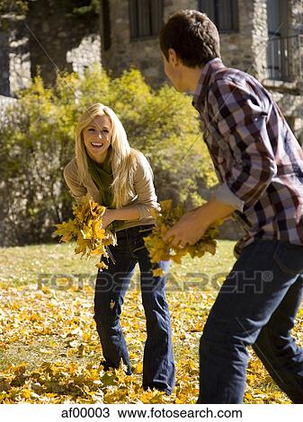 USA, Utah, Provo, Young couple having fun in park View Large Photo Image Stock Image - USA, Utah, Provo, Young couple having fun in park. Fotosearch