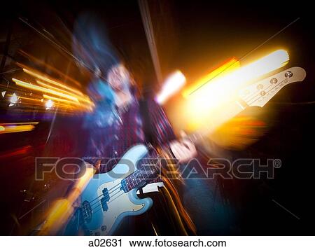 Stock Image - USA, Utah, Provo, young man playing electric guitar. Fotosearch