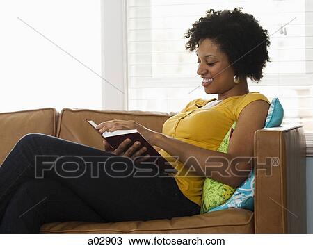 USA, Utah, Provo, young woman reading book on couch View Large Photo Image Stock Image - USA, Utah, Provo, young woman reading book on couch. Fotosearch