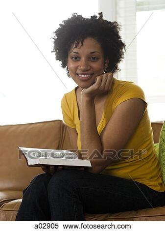 USA, Utah, Provo, young woman reading book on couch, portrait View Large Photo Image Stock Photography - USA, Utah, Provo, young woman reading book on couch, portrait. Fotosearch