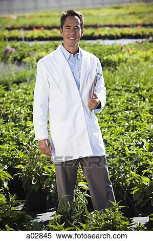 USA, Utah, Salem, portrait of scientist with clipboard in field View Large Photo Image Stock Photography - USA, Utah, Salem, portrait of scientist with clipboard in field. Fotosearch