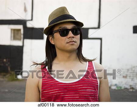 USA, Utah, Salt Lake City, Close-up of man wearing sunglasses and hat View Large Photo Image Stock Photo - USA, Utah, Salt Lake City, Close-up of man wearing sunglasses and hat. Fotosearch
