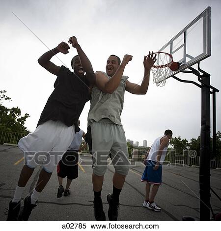 USA, Utah, Salt Lake City, four young men playing street basketball View Large Photo Image Stock Photography - USA, Utah, Salt Lake City, four young men playing street basketball. Fotosearch