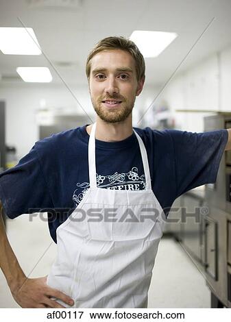 Stock Photo - USA, Utah, Salt Lake City, Portrait of chef in bakery. Fotosearch