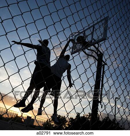 USA, Utah, Salt Lake City, two young men playing street basketball, low angle view View Large Photo Image Stock Image - USA, Utah, Salt Lake City, two young men playing street basketball, low angle view. Fotosearch