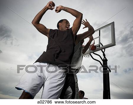 USA, Utah, Salt Lake City, two young men playing street basketball View Large Photo Image Stock Photograph - USA, Utah, Salt Lake City, two young men playing street basketball. Fotosearch