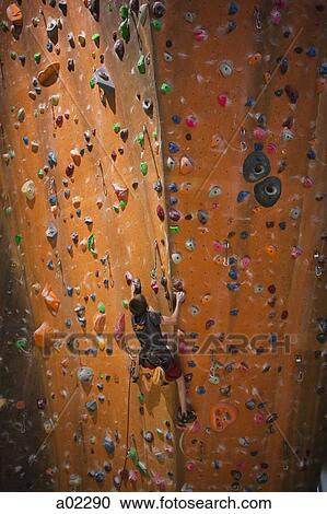 USA, Utah, Sandy, boy (12-13) on indoor climbing wall View Large Photo Image Stock Image - USA, Utah, Sandy, boy (12-13) on indoor climbing wall. Fotosearch