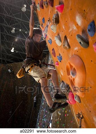 USA, Utah, Sandy, boy (12-13) on indoor climbing wall View Large Photo Image Stock Image - USA, Utah, Sandy, boy (12-13) on indoor climbing wall. Fotosearch