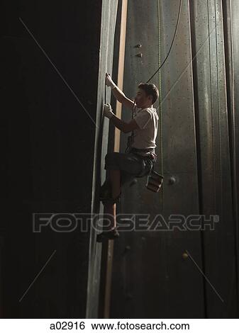 USA, Utah, Sandy, boy climbing in indoor climbing gym, side view View Large Photo Image Stock Photograph - USA, Utah, Sandy, boy climbing in indoor climbing gym, side view. Fotosearch