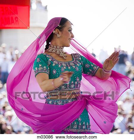 Stock Photograph - USA, Utah, Spanish Fork, Mid adult woman dancing in sari. Fotosearch