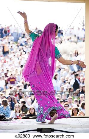 USA, Utah, Spanish Fork, rear view of mid adult dancer in traditional clothing performing on stage View Large Photo Image Stock Image - USA, Utah, Spanish Fork, rear view of mid adult dancer in traditional clothing performing on stage. Fotosearch