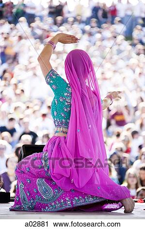 USA, Utah, Spanish Fork, rear view of mid adult dancer in traditional clothing performing on stage View Large Photo Image Stock Image - USA, Utah, Spanish Fork, rear view of mid adult dancer in traditional clothing performing on stage. Fotosearch