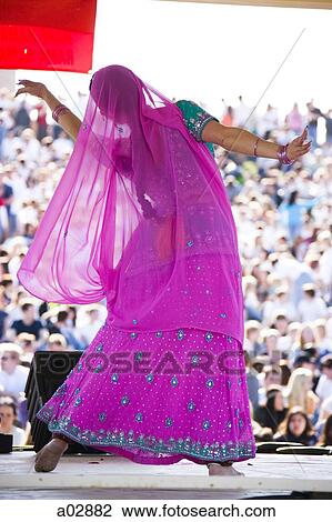 USA, Utah, Spanish Fork, rear view of mid adult dancer in traditional clothing performing on stage View Large Photo Image Stock Image - USA, Utah, Spanish Fork, rear view of mid adult dancer in traditional clothing performing on stage. Fotosearch