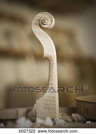 Stock Image - violin maker in the workshop. Fotosearch
