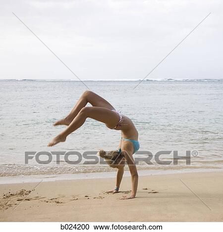 woman doing a handstand in a bikini View Large Photo Image Stock Image - woman doing a handstand in a bikini. Fotosearch