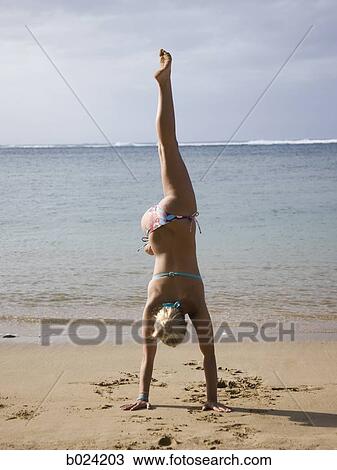 woman doing a handstand in a bikini View Large Photo Image Stock Image - woman doing a handstand in a bikini. Fotosearch