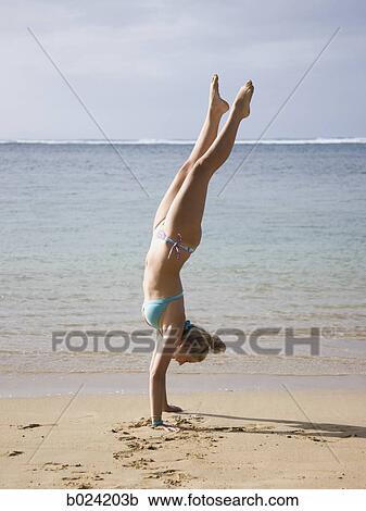 woman doing a handstand in a bikini View Large Photo Image Stock Image - woman doing a handstand in a bikini. Fotosearch