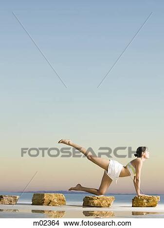 woman doing yoga in the middle of nowhere View Large Photo Image Picture - woman doing yoga in the middle of nowhere. Fotosearch