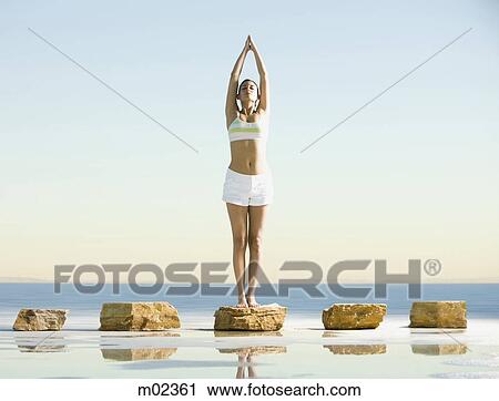 woman doing yoga in the middle of nowhere View Large Photo Image Stock Image - woman doing yoga in the middle of nowhere. Fotosearch
