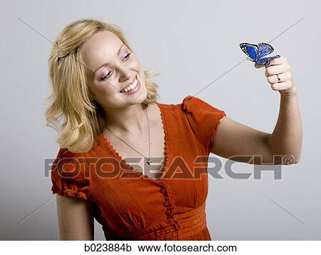 woman holding a butterfly View Large Photo Image Stock Image - woman holding a butterfly. Fotosearch
