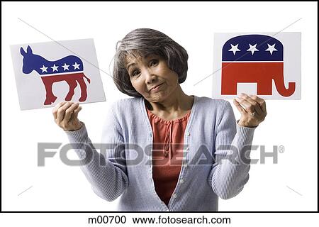 woman holding up political party signs View Large Photo Image Stock Image - woman holding up political party signs. Fotosearch
