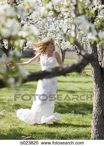 Stock Image - woman in a white dress. Fotosearch