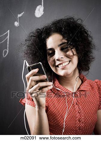 woman listening to mp3 player View Large Photo Image Stock Image - woman listening to mp3 player. Fotosearch