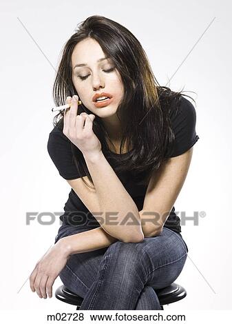 woman smoking a cigarette View Large Photo Image Stock Photo - woman smoking a cigarette. Fotosearch
