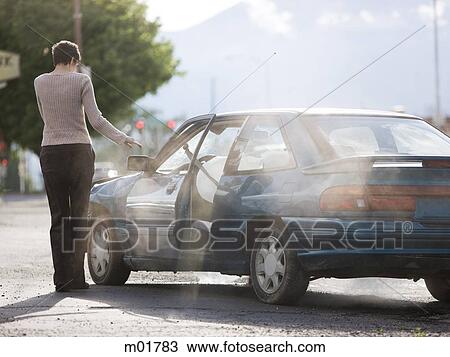 woman standing by her car after an accident View Large Photo Image Stock Image - woman standing by her car after an accident. Fotosearch