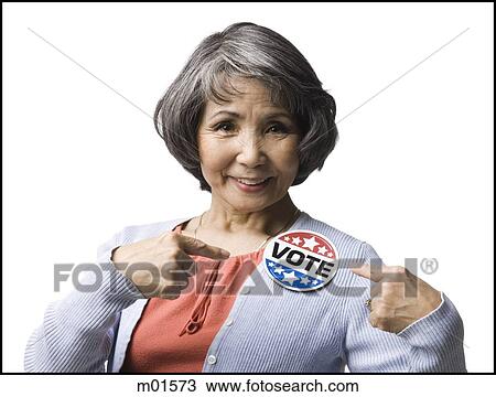 Stock Image - woman with a "vote" button. Fotosearch