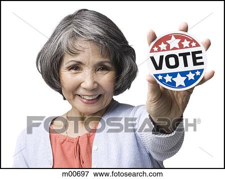 woman with a "vote" button View Large Photo Image Stock Photo - woman with a "vote" button. Fotosearch