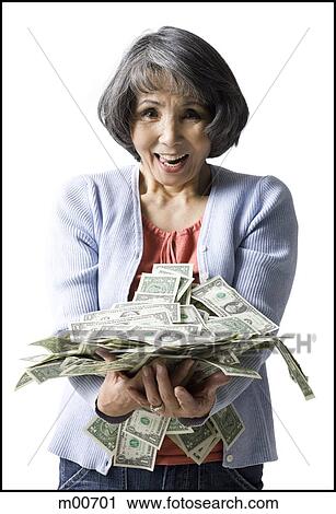Stock Image - woman with an armfull of money. Fotosearch