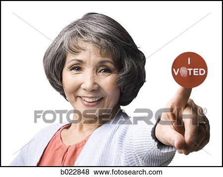 woman with an "i voted" sticker View Large Photo Image Stock Photo - woman with an "i voted" sticker. Fotosearch