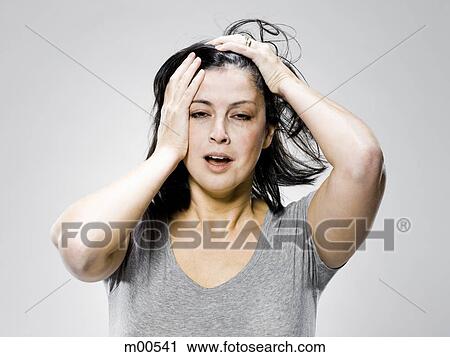 woman with her hands on her head View Large Photo Image Stock Image - woman with her hands on her head. Fotosearch