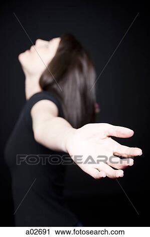 Stock Image - Woman with outstretched arms. Fotosearch