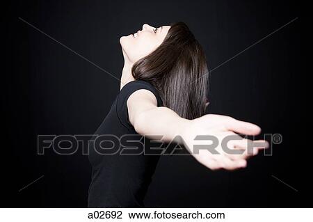 Stock Image - Woman with outstretched arms. Fotosearch